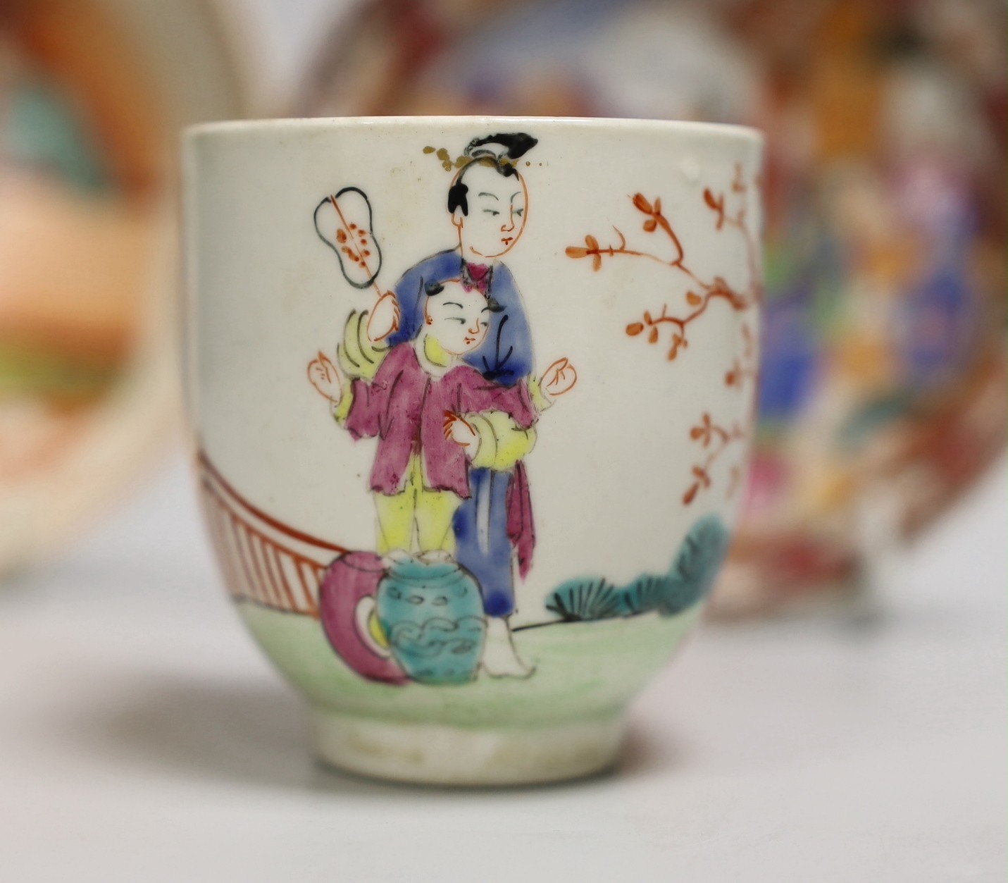 An 18th century Worcester porcelain coffee cup, a later saucer and a Chinese saucer, cup 6.5cms high